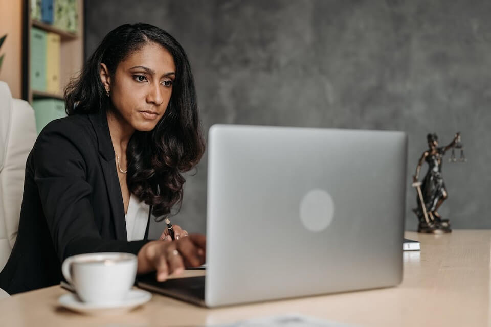 woman in office using laptop computer